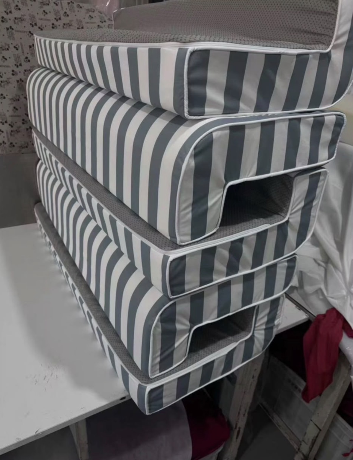 Finished Akti cushions stacked in the workroom before despatch