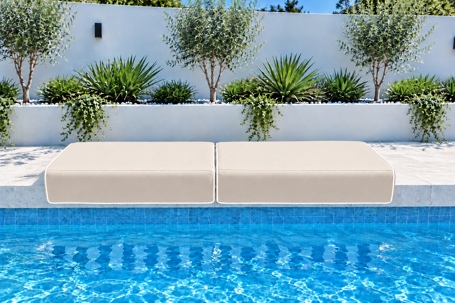 Two solid beige Ammos Large Akti cushions with white piping beside the pool